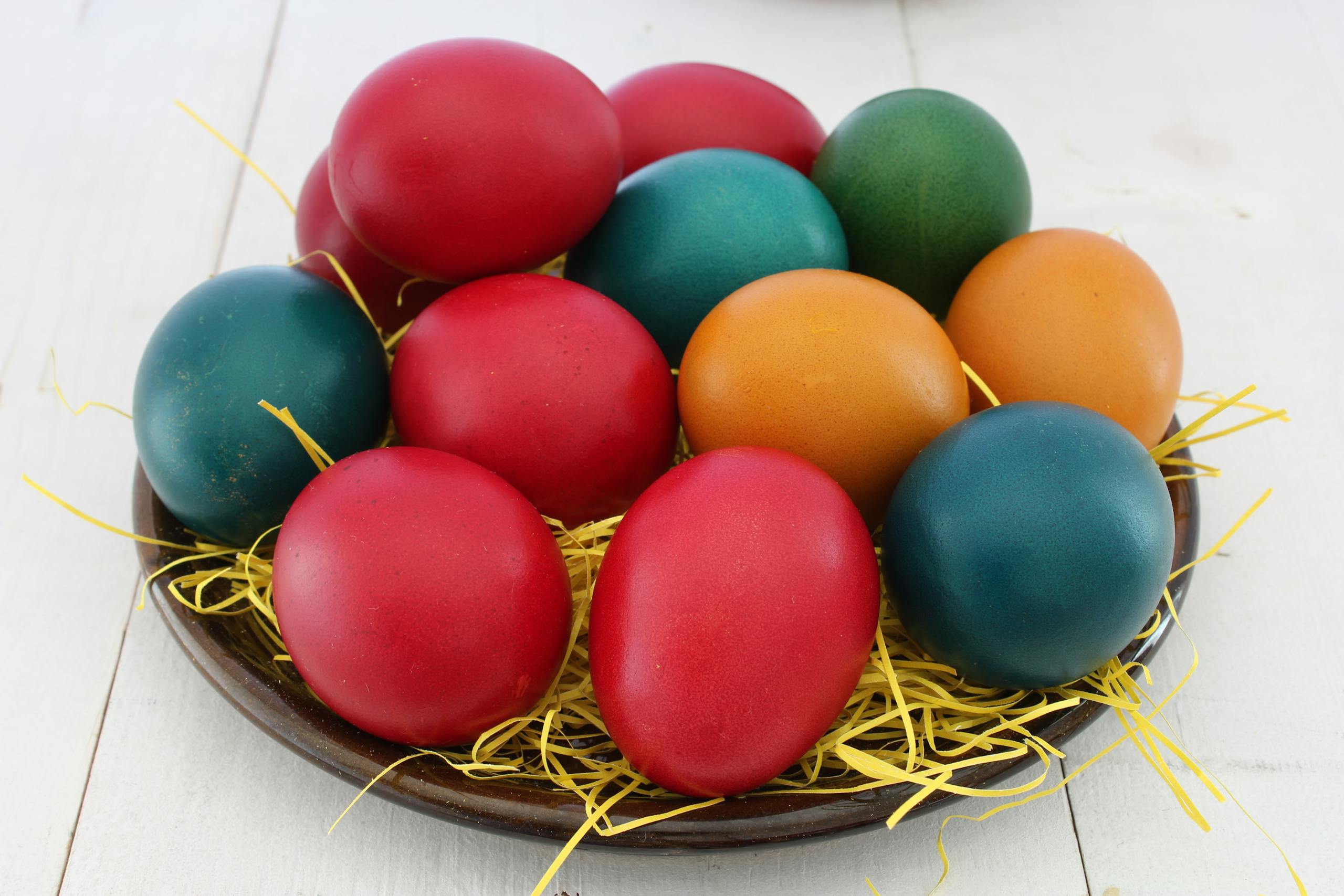 Vibrant Easter eggs arranged in a decorative nest, symbolizing traditional Easter celebration.